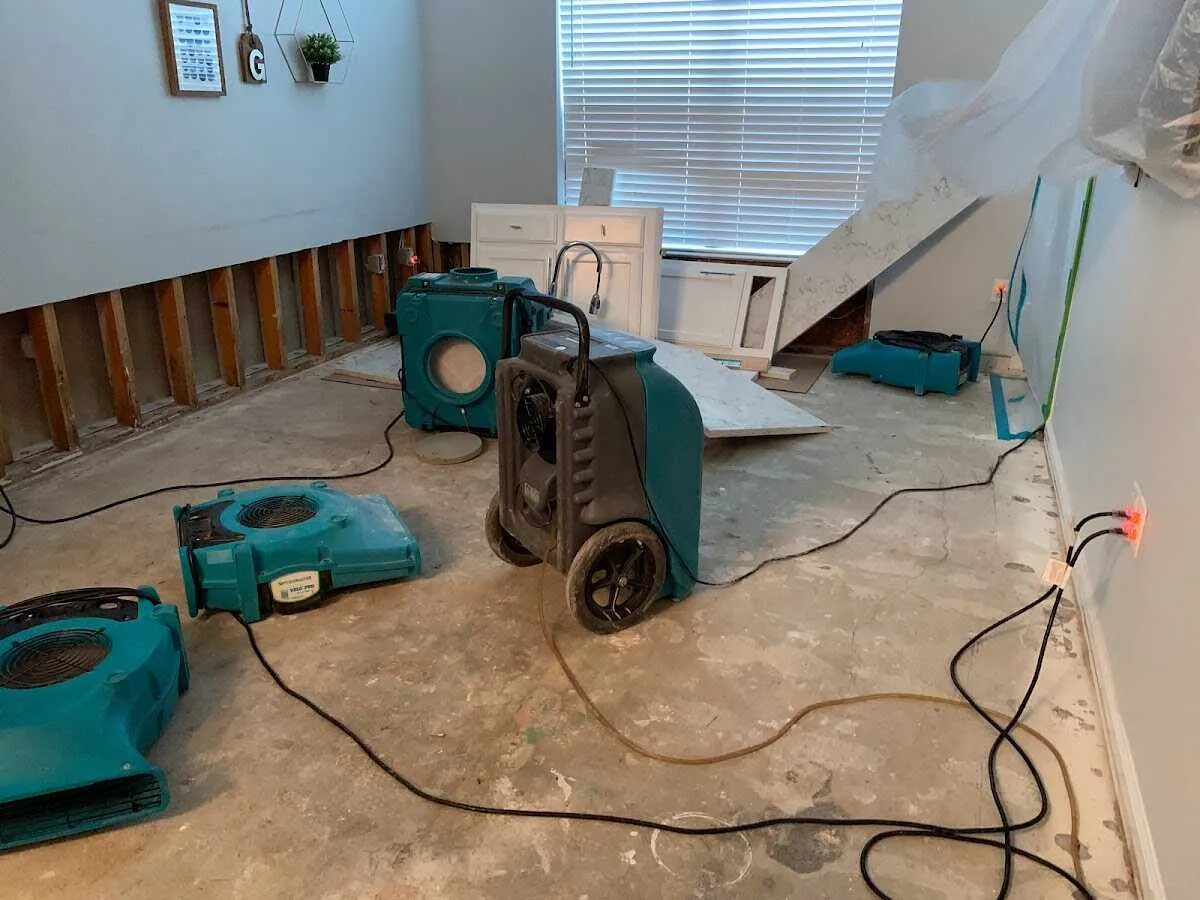 Dehumidifier in flood-cut room for Water Damage Restoration in Cheval